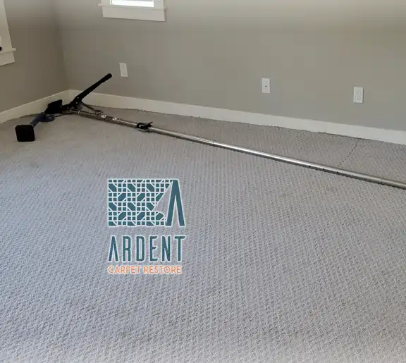 Carpet re-stretchin in process with a power stretcher